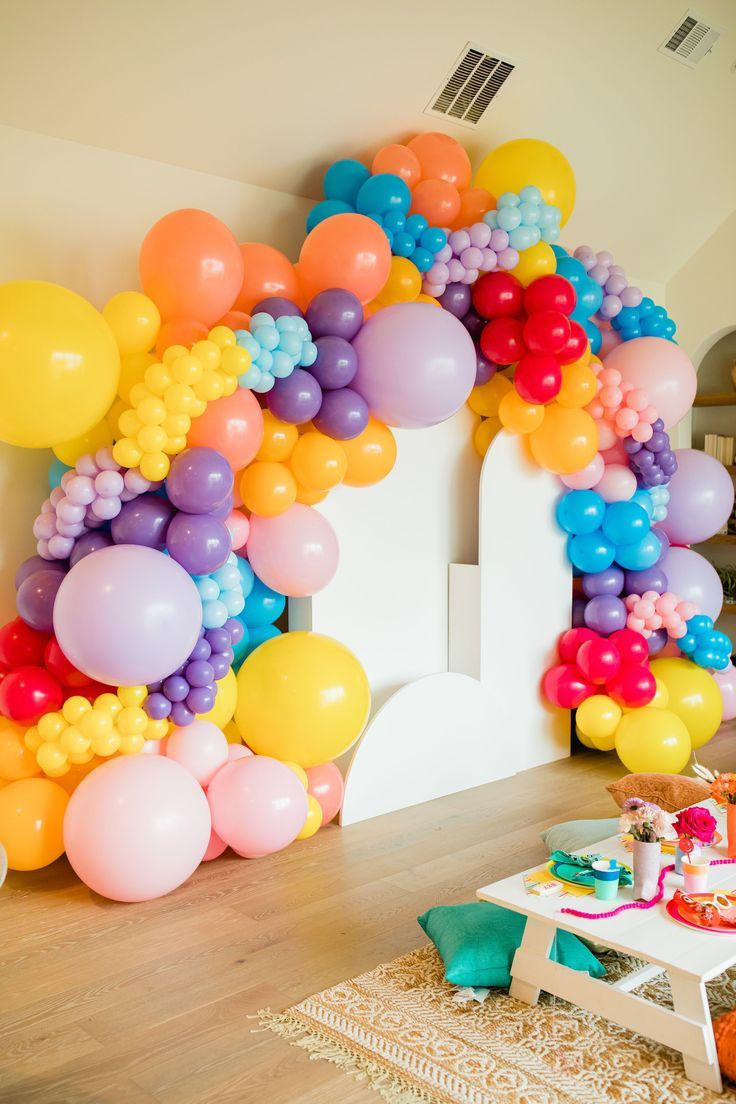 White Arch Backdrop with Colorful Balloons.jpeg