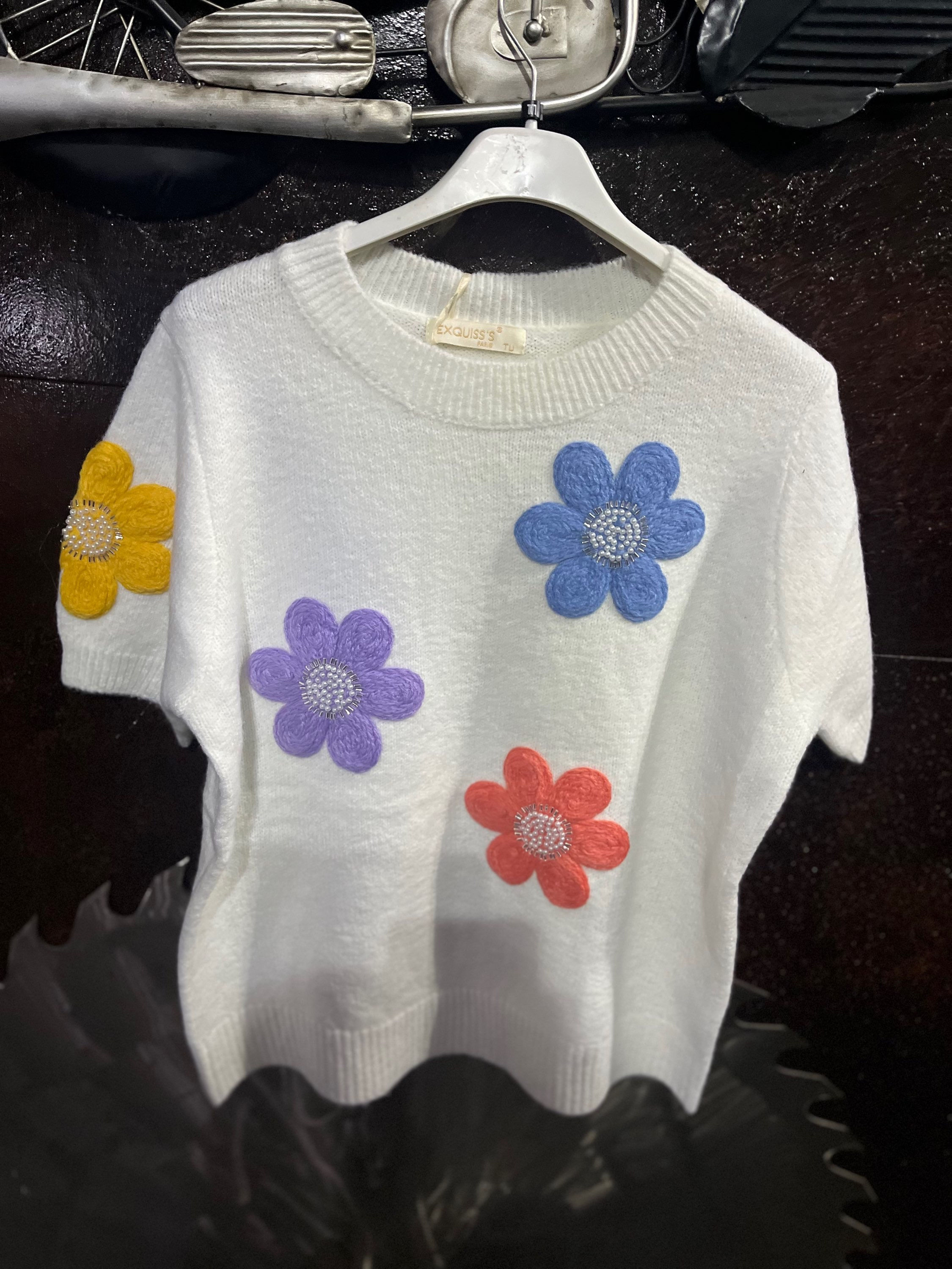 Pull sans manches blanc avec fleurs 