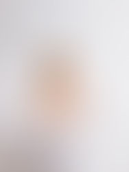 Smiling baby boy splashing in a small white bathtub during his first birthday photo session at Amy Tong Photography studio in Sydney’s Inner West.