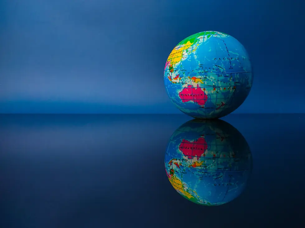 Earth globe with reflection on a black acrylic board