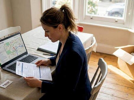 Estate agent reviews property valuation report