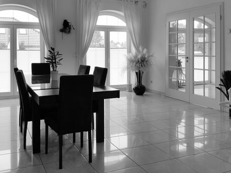 Estate agent consulting with clients in office