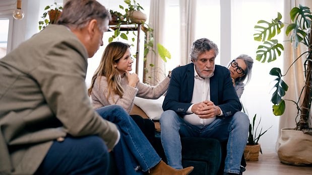 concerned-family-members-console-sad-senior-man-2026-03-08-22-59-48-utc.jpg