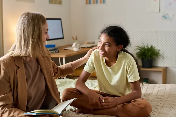 teenager-talking-with-an-adult-in-a-bedroom-2026-03-27-00-35-43-utc.webp