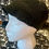 Thumbnail: Side profile of model wearing black crochet hat