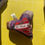 Thumbnail: Heart cushion with hugs ribbon