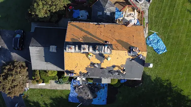 Photo roof replacement marriottsville md crew removing shingles aerial view.webp