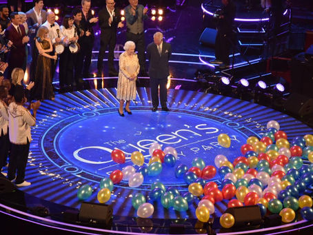 The Queen and The Prince of Wales appear on stage at the birthday concert.