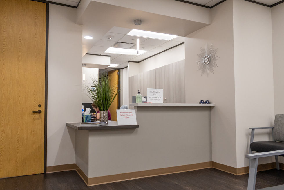 Luxury medical office reception desk with modern lighting.