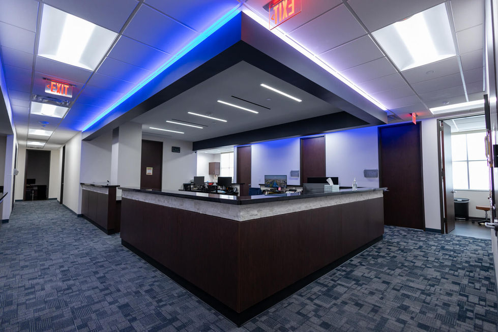 Modern office interior with blue accent lighting.