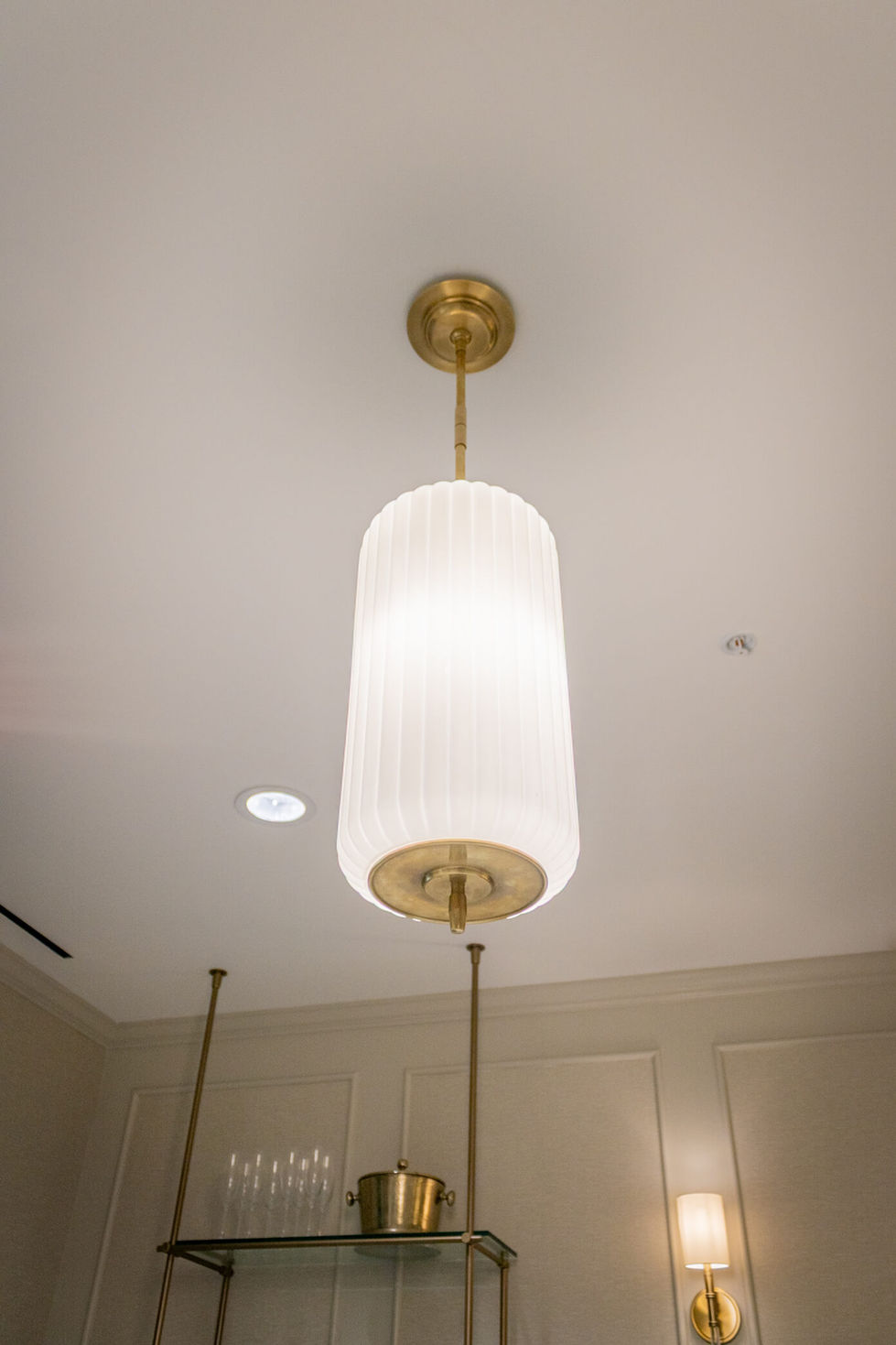 a light hanging from the ceiling in a room