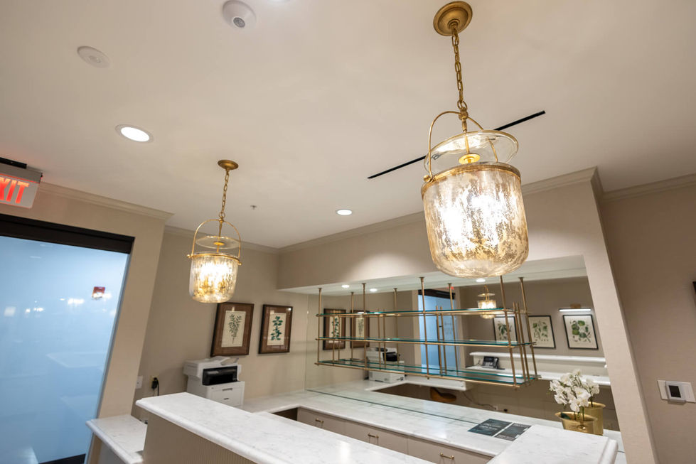 Elegant interior with hanging glass lanterns and framed art.