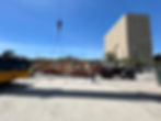 Unloading crane part for assembly.
