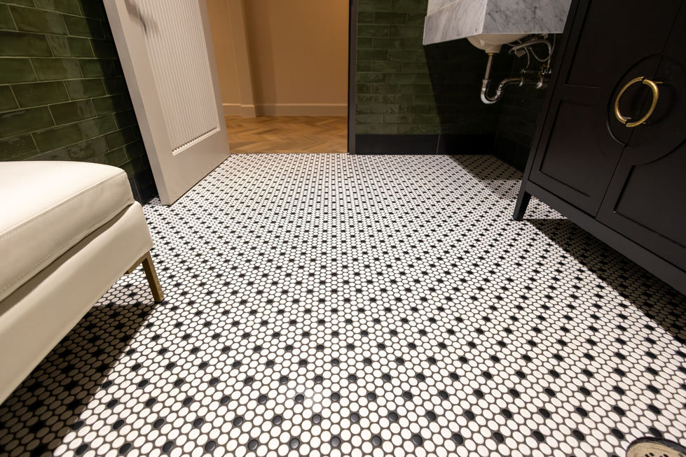 Black and white penny tile bathroom floor.