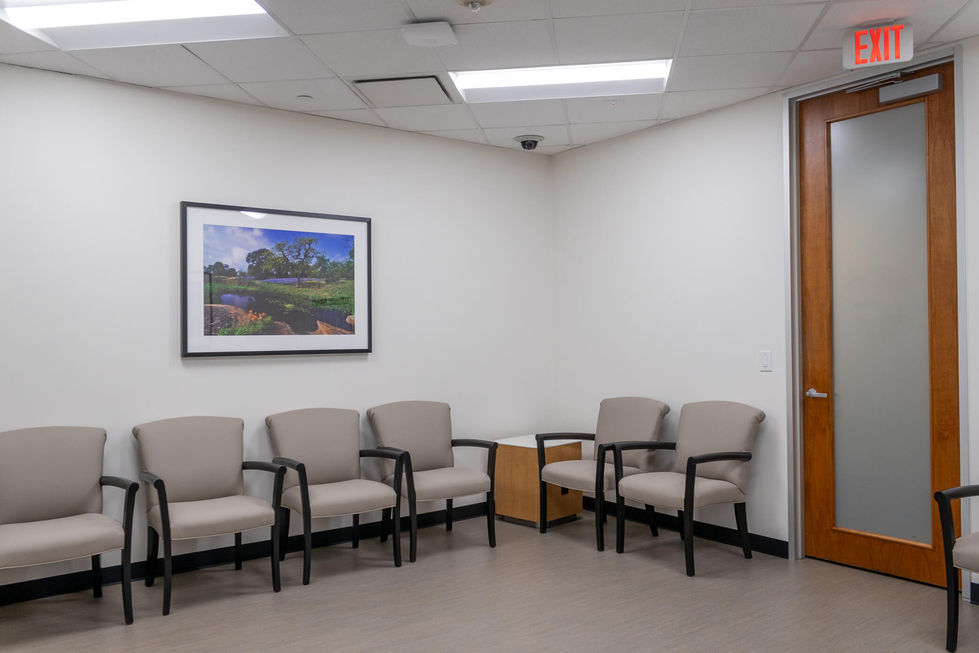 Luxurious medical office waiting room with chairs and a picture on the wall