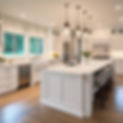 white kitchen with grey island waterfall quartz simple lighting.jpg