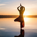 silhouette-yoga-woman-on-the-beach-at-sunset