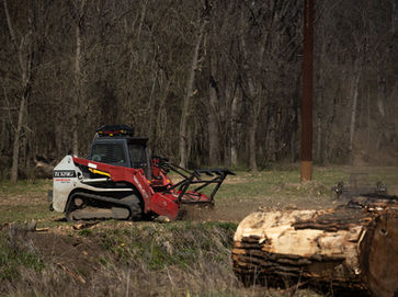 Skid steer with mulcher Takeuchi, TL12R2, Fecon Mulcher, right of way, log in forefront