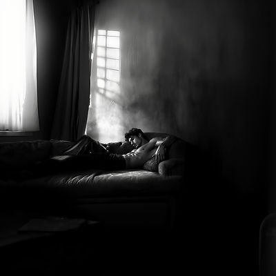 aminssh_in_a_wide_resolution_a_male_model_lying_on_a_couch_in_b_cc2a2aae-73ec-423e-b544-86