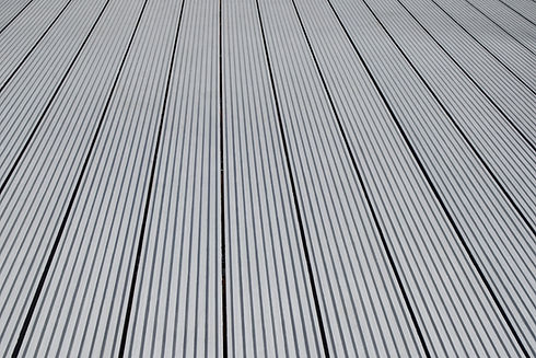 Dark gray or anthracite wpc material composite board deck for the construction of terrace.