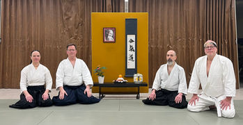 Aikido Northway members seated in front of the dojo kamiza decorated for kagamibiraki ceremony