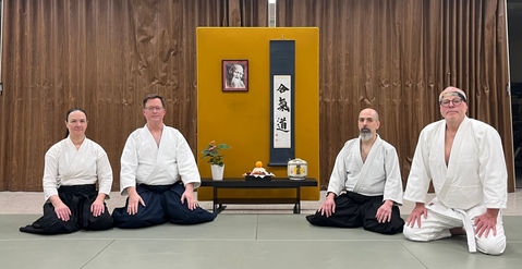 Aikido Northway members seated in front of the dojo kamiza decorated for kagamibiraki ceremony