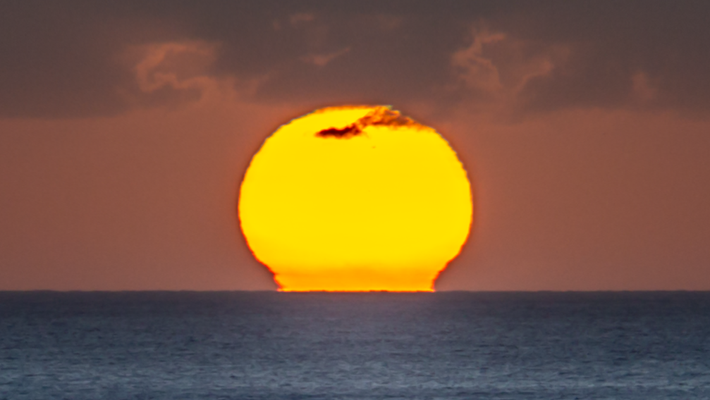 Sunset touches the ocean