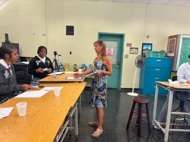 Jessica Parker White, the Education Coordinator at CMCArts with students