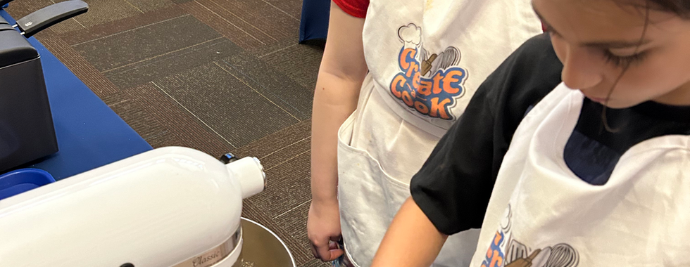 adding dry mixture to our cookie dough!