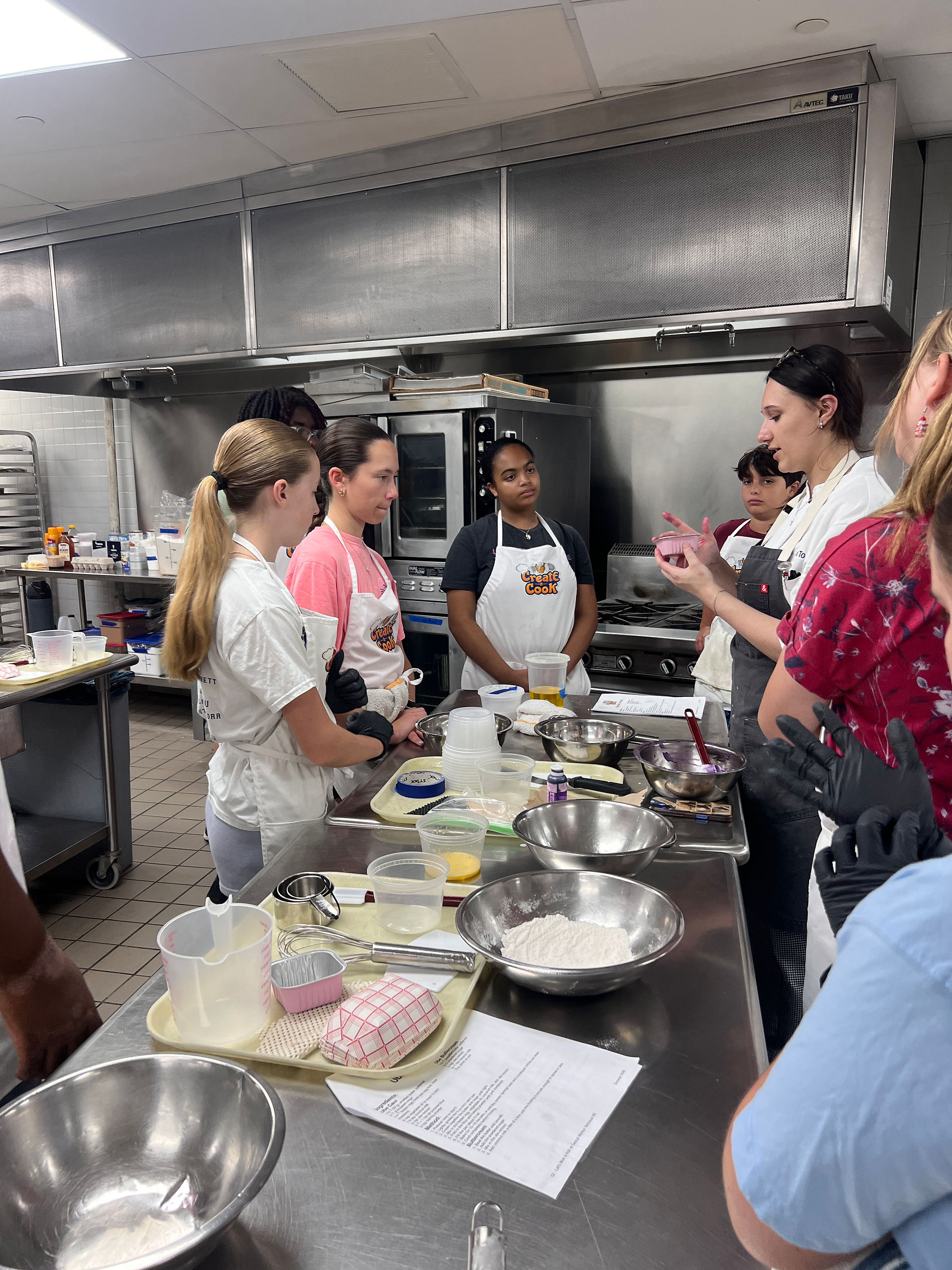Junior Chefs listen in as Instructor Ava teaches them important skills.  