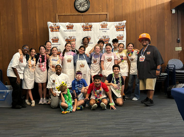 Junior chefs and CaC staff pose for a picture ont heir final day of camp!