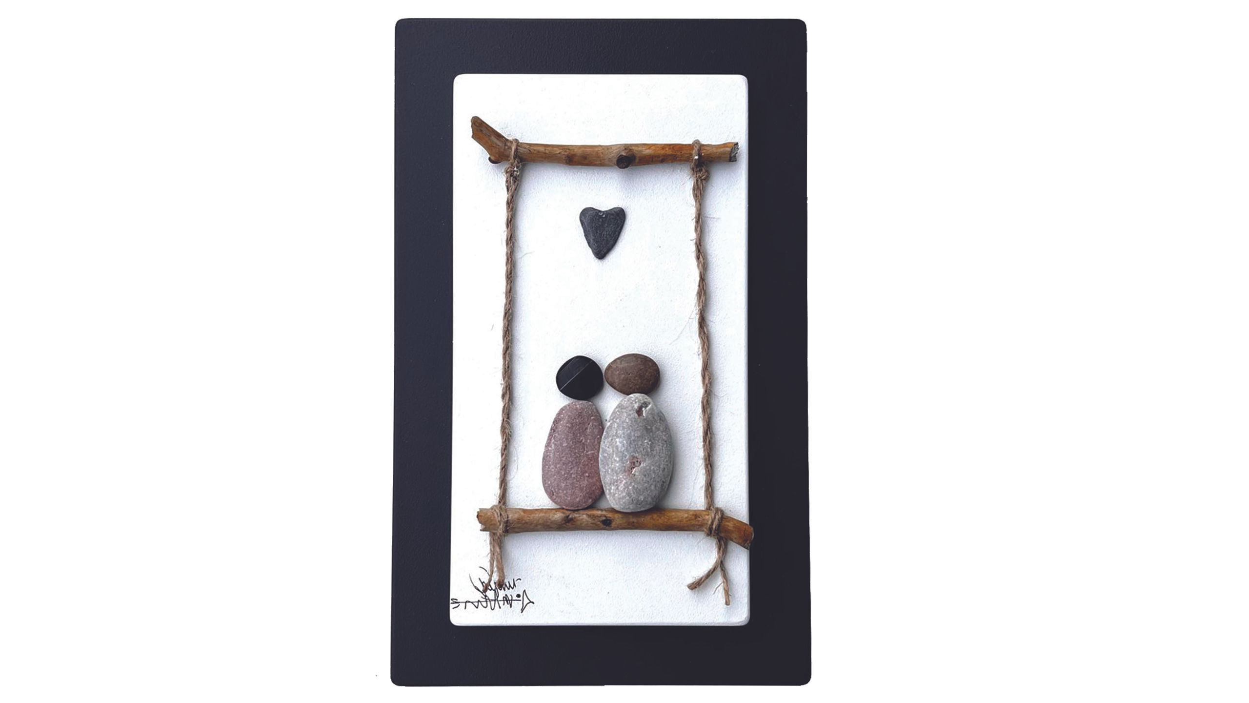 pebble art couple on swing with pebble heart