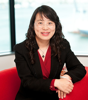 Carol Cheng - Founder of Hong Consulting sits on a sofa