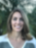 Headshot of a smiling Tracy Perez, outdoors and in a striped sweater, who is Regional Director of CHC-FL, whose programs include summer camp for deaf and hard of hearing children in Broward County.
