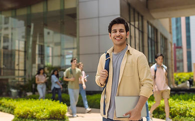 Student walking on university campus while preparing for international studies with Edwell Global Academy.