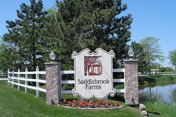 The Saddlebrook Farms entrance sign