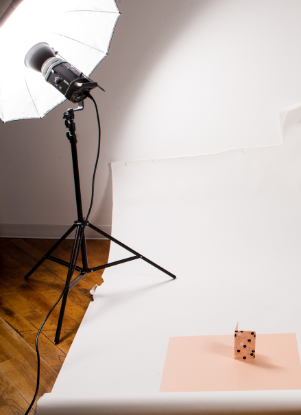 Inside a photo studio with studio lights.