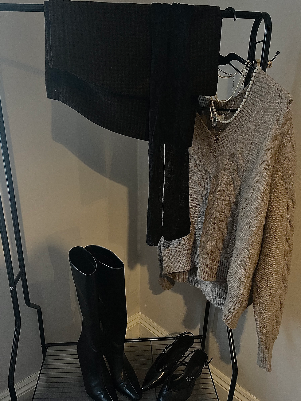 Sweater, mini skirt, tights and boots or kitten heels.