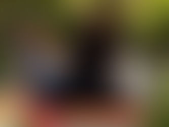 Patient doing leg stretches with therapist at home