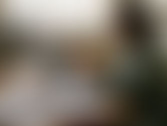 Woman booking physiotherapy online at kitchen table