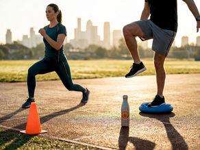 Adults doing knee warmup at city track