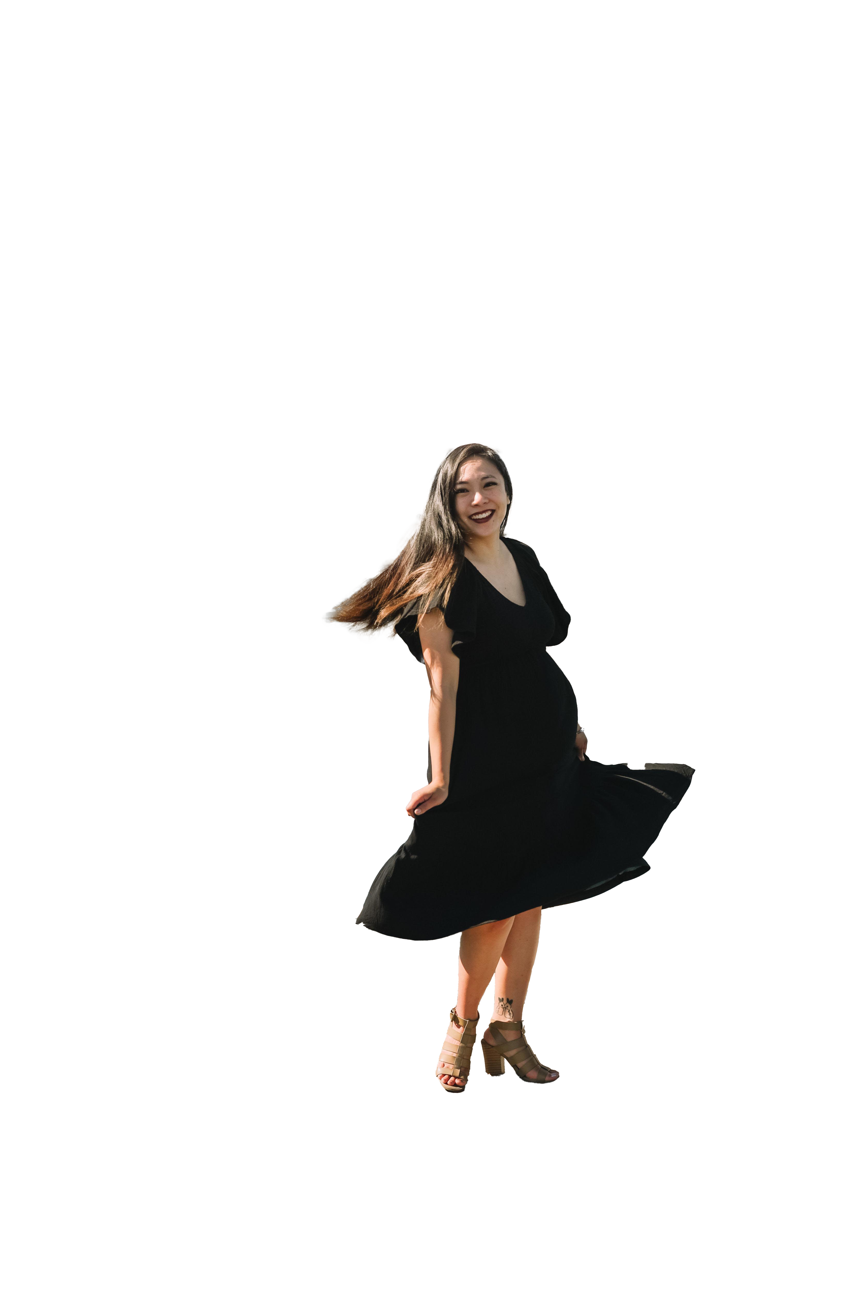 Rizza looking at the camera and spinning on a habor pier with boats in the background, transparent background.