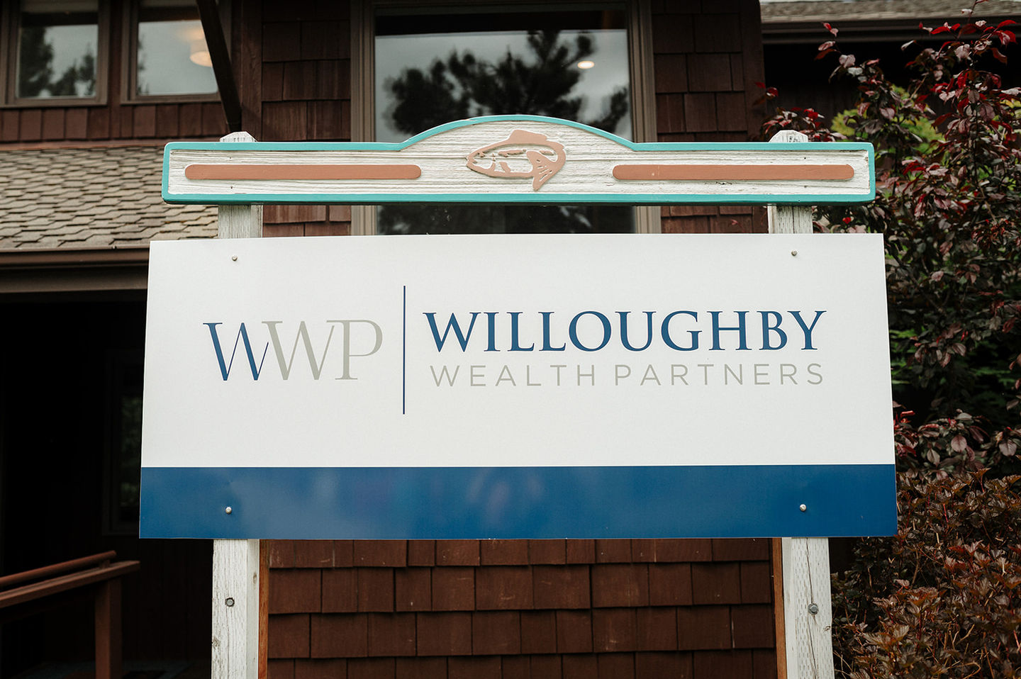 Willoughby Wealth Partners logo and branding by Z Squared Studio on an outside sign.