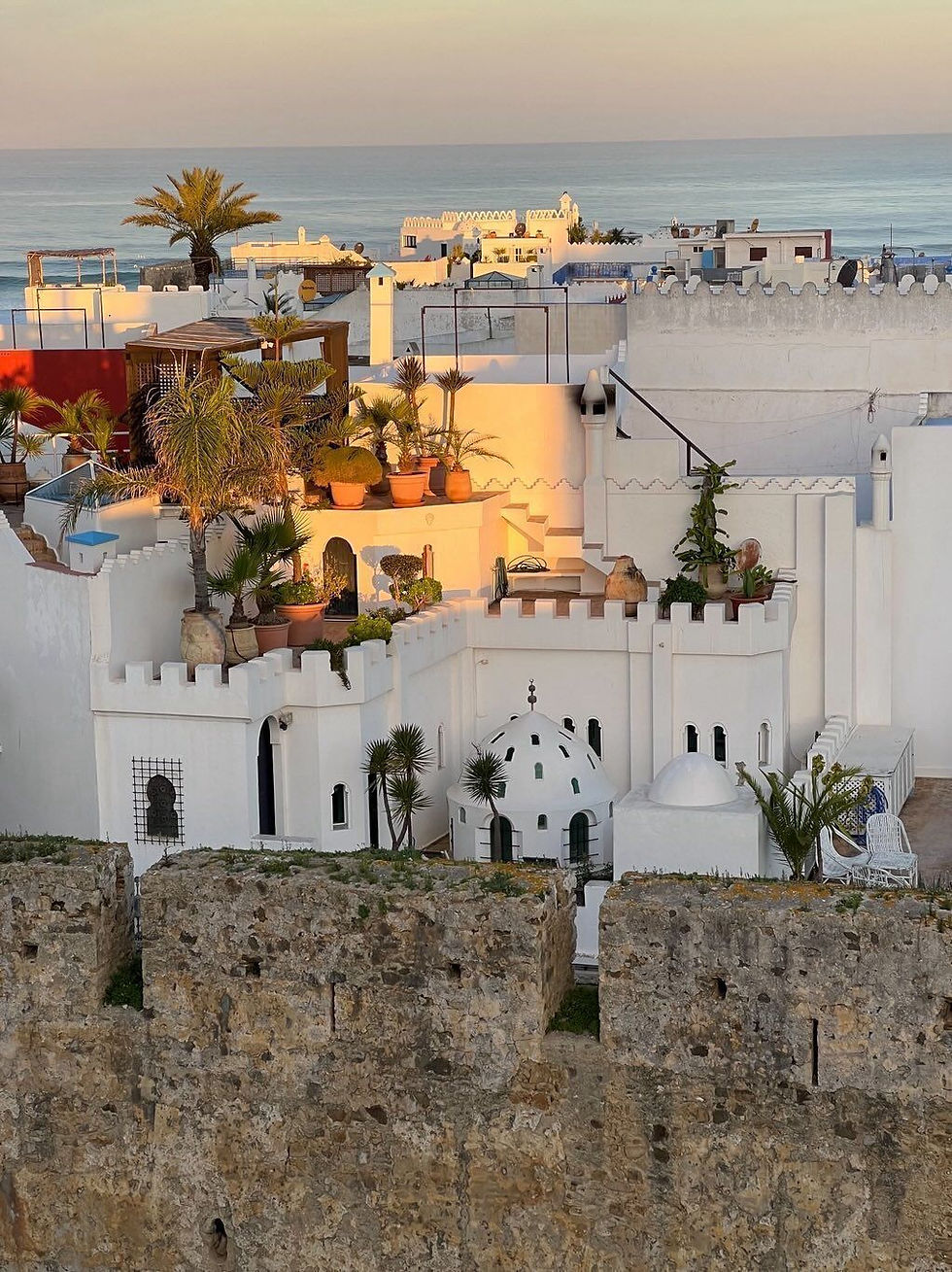 The whitewashed exterior of a riad hotel in Asilah, Morocco