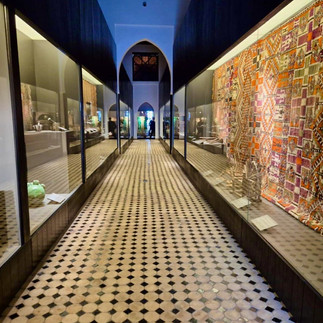 Handwoven carpets on display in one of the galleries of Dar Batha Museum in Fes
