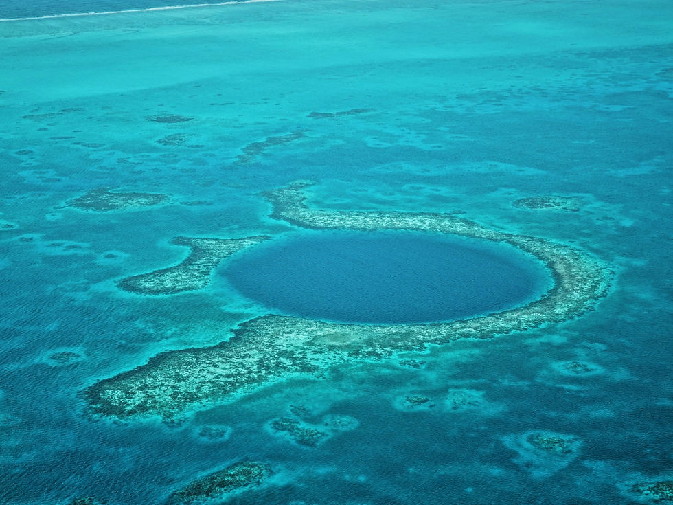 An aerial view of the Great Blue Hole off the coast of Belize