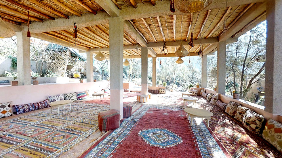 Amazigh rugs decorate a communal area at a farmstay in Ourika