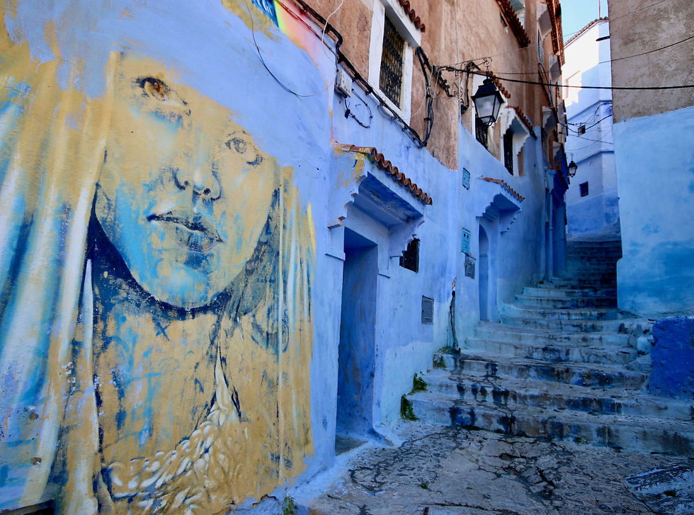 A mural adorns one of the blue walls in the Chefchaouen medina