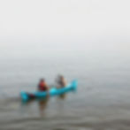East Timorese fishermen in a blue canoe