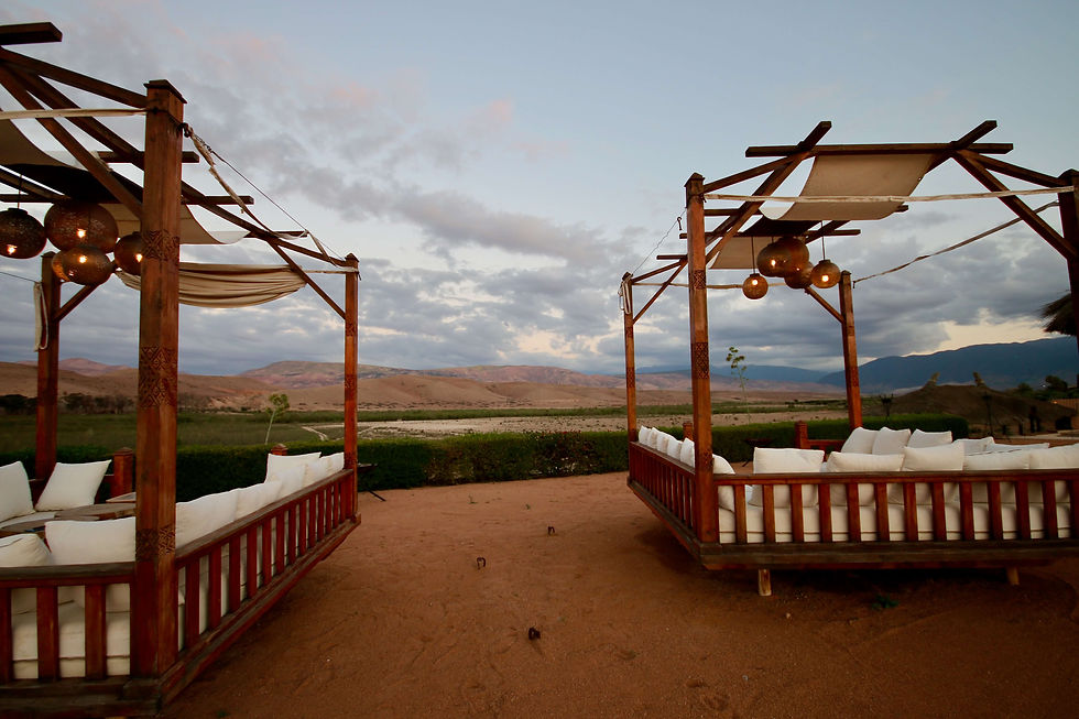 Cabanas overlooking a river valley in the desert region of Agafay